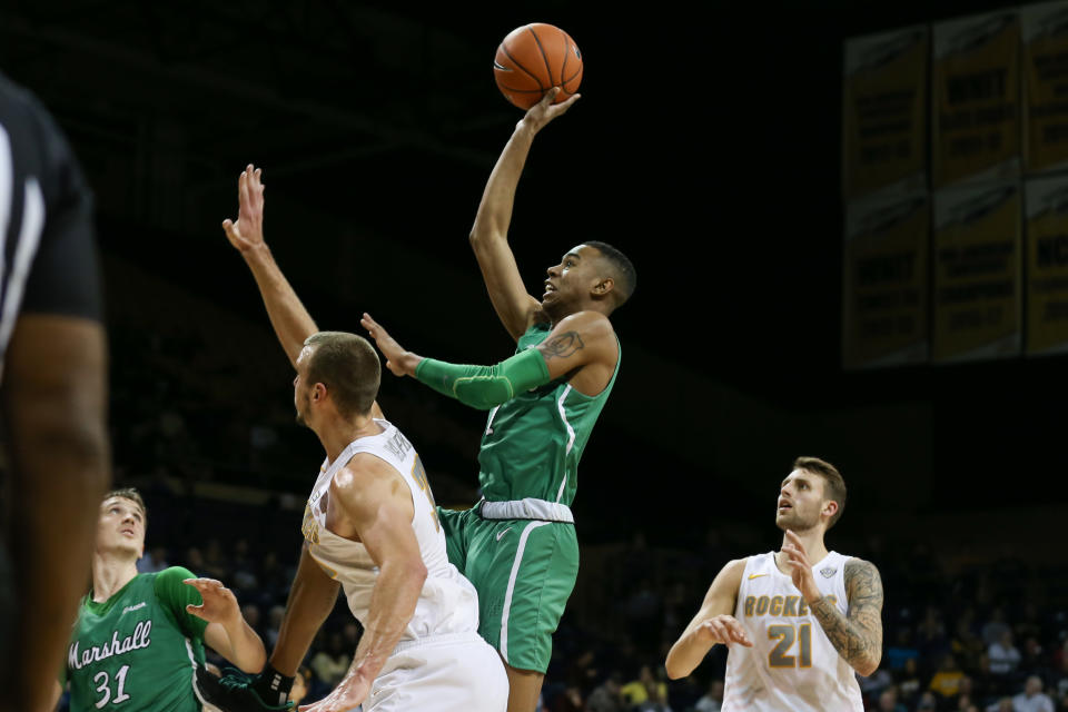 Marshall guard Taevion Kinsey shoot over Toledo center Luke Knapke (30) while guard Dylan Alderson (21) and blocks out during their game on Dec. 8, 2019. (Scott W. Grau/Icon Sportswire via Getty Images)