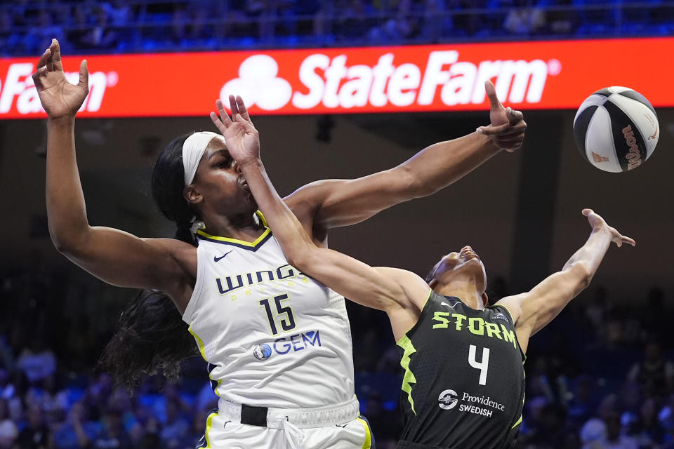 Dallas Wings center Teaira McCowan (15) blocks a shot by Seattle Storm guard Skylar Diggins-Smith (4) during the first half of a WNBA basketball basketball game in Arlington, Texas, Thursday, June 13, 2024. (AP Photo/LM Otero)