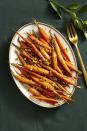 <p>Paprika, nutmeg, and chopped pistachios spice-up this traditional holiday side.</p><p><em><a href="https://www.goodhousekeeping.com/food-recipes/a14891/spice-roasted-carrots-recipe-ghk1114/" rel="nofollow noopener" target="_blank" data-ylk="slk:Get the recipe for Spice-Roasted Carrots »;elm:context_link;itc:0;sec:content-canvas" class="link ">Get the recipe for Spice-Roasted Carrots »</a></em></p>