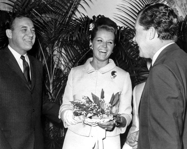 Richard Nixon, right, laughs with Gov. Claude Kirk and bride Erika Mattfeld Kirk during their wedding celebration in Palm Beach on Feb. 18, 1967.