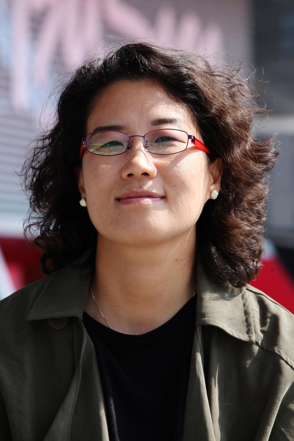 In this Oct. 4, 2013 photo, South Korean Director Kim Lyang poses during an interview with the Associated Press at Busan Cinema Center in Busan, South Korea. The 41-year-old Kim struggled to reconcile her father’s origin growing up during a time of widespread fear of another communist invasion and North Korean spies. “It did not feel natural for me to say my father’s hometown was North Korea,” Kim said during the interview. (AP Photo/Woohae Cho)
