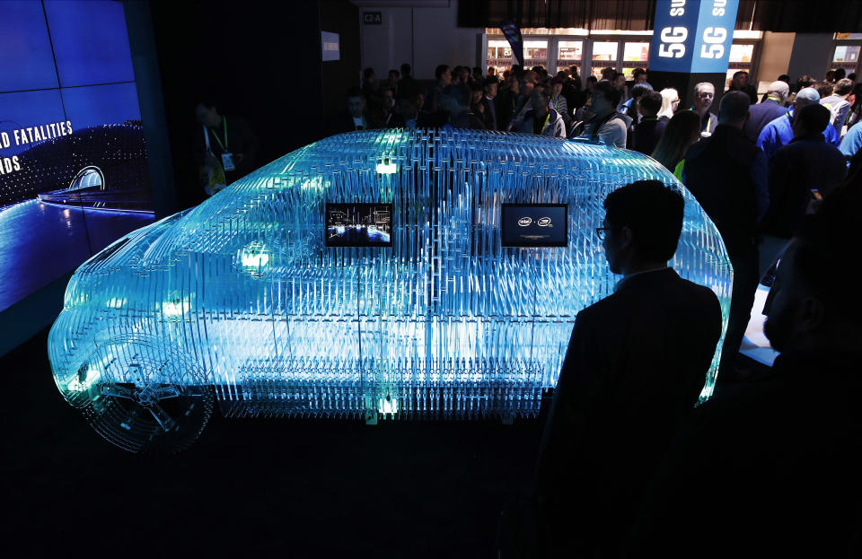 FILE - In this Jan. 9, 2018, file photo a model of a car displays Intel Mobileye sensor technology at the Intel booth during CES International in Las Vegas. Intel Corp. reports financial earnings on Thursday, July 25, 2019. (AP Photo/John Locher, File)