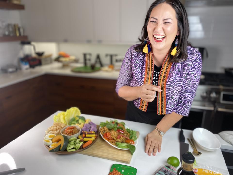 In her own kitchen, Nikky Phinyawatana, the creator and owner of Dallas' highly acclaimed, award-winning Asian Mint Restaurants, shows off completed dishes from her at-home Zoom cooking experience through her brand Nikky Feeding Souls. (Nikky Feeding Souls)