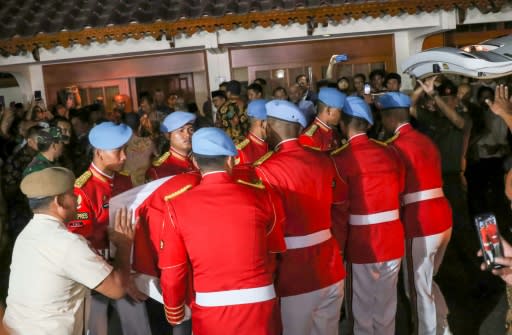 Indonesia's presidential honour guard officers carry the coffin of former president B.J. Habibie in Jakarta