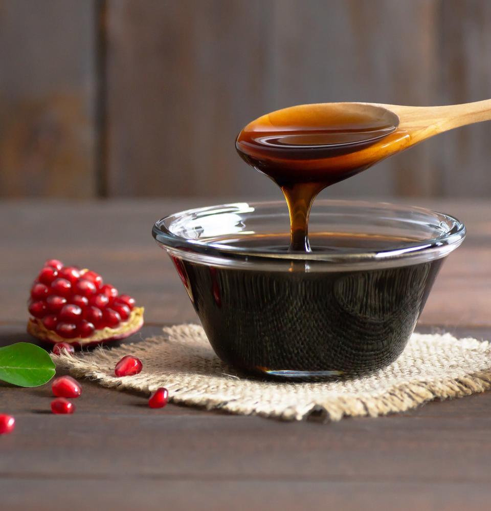 a bowl of pomegranate molasses