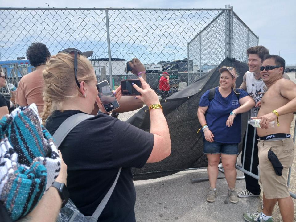 Rain City Drive lead singer Matt McAndrew poses for pictures with fans at Day 2 of Welcome to Rockville at Daytona International Speedway on Friday, May 10, 2024.
