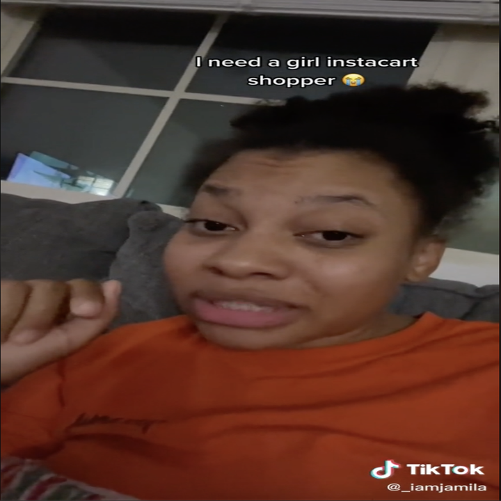 Screengrab of a TikTok by user _iamjamila of her sitting on the couch looking into the camera with the annotation 