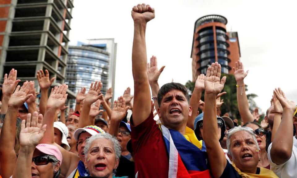 Opposition supporters react during a rally against President Nicolás Maduro’s government in Caracas on Wednesday.