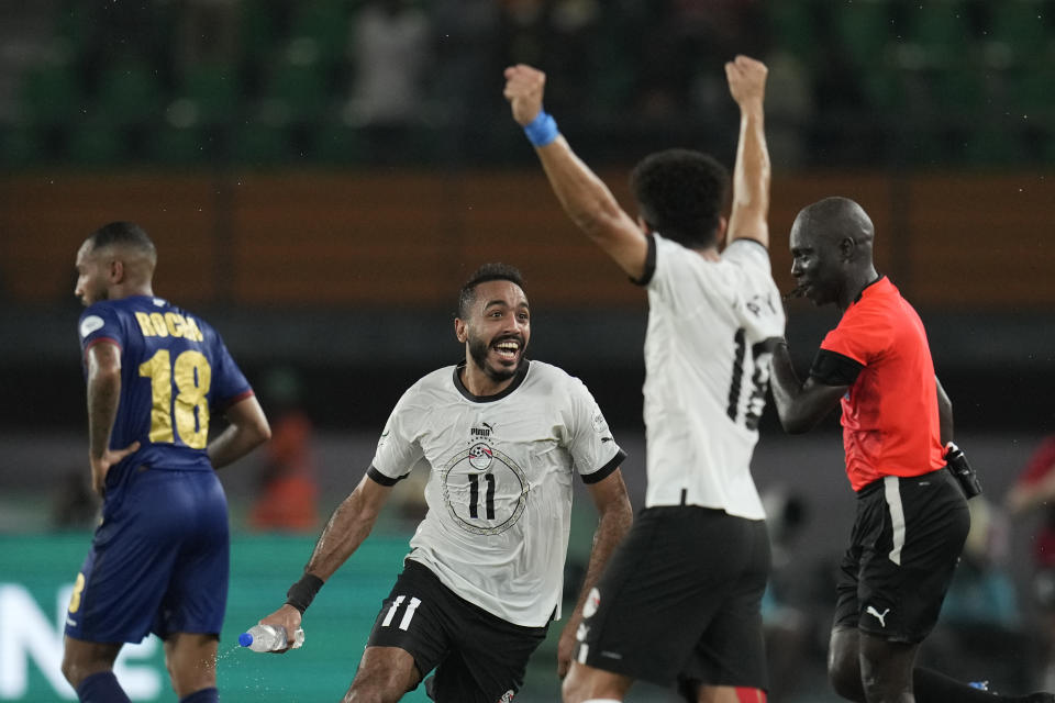 Egypt players celebrate after Mostafa Mohamed scored his side's second goal during the African Cup of Nations Group B soccer match between Cape Verde and Egypt at the Felix Houphouet Boigny stadium in Abidjan, Ivory Coast, Monday, Jan. 22, 2024. (AP Photo/Themba Hadebe)