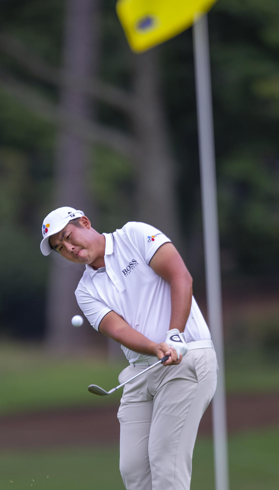 Byeong Hun An chips onto the ninth green during the second round of the Wyndham Championship golf tournament at Sedgefield Country Club in Greensboro, N.C., Friday, Aug. 2, 2019. (H. Scott Hoffmann/News & Record via AP)