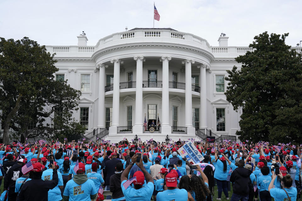 President Donald Trump speaks from the Blue Room Balcony of the White House to a crowd of supporters, Saturday, Oct. 10, 2020, in Washington. (AP Photo/Alex Brandon)