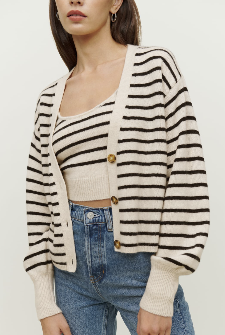 <p><strong>Reformation</strong></p><p>thereformation.com</p><p><strong>$228.00</strong></p><p>Help ease them out of their Teen Uniform (oversized sweatshirt and leggings) with the cutest and coziest cardi set. Good for outside the house <em>and also napping</em>.</p>