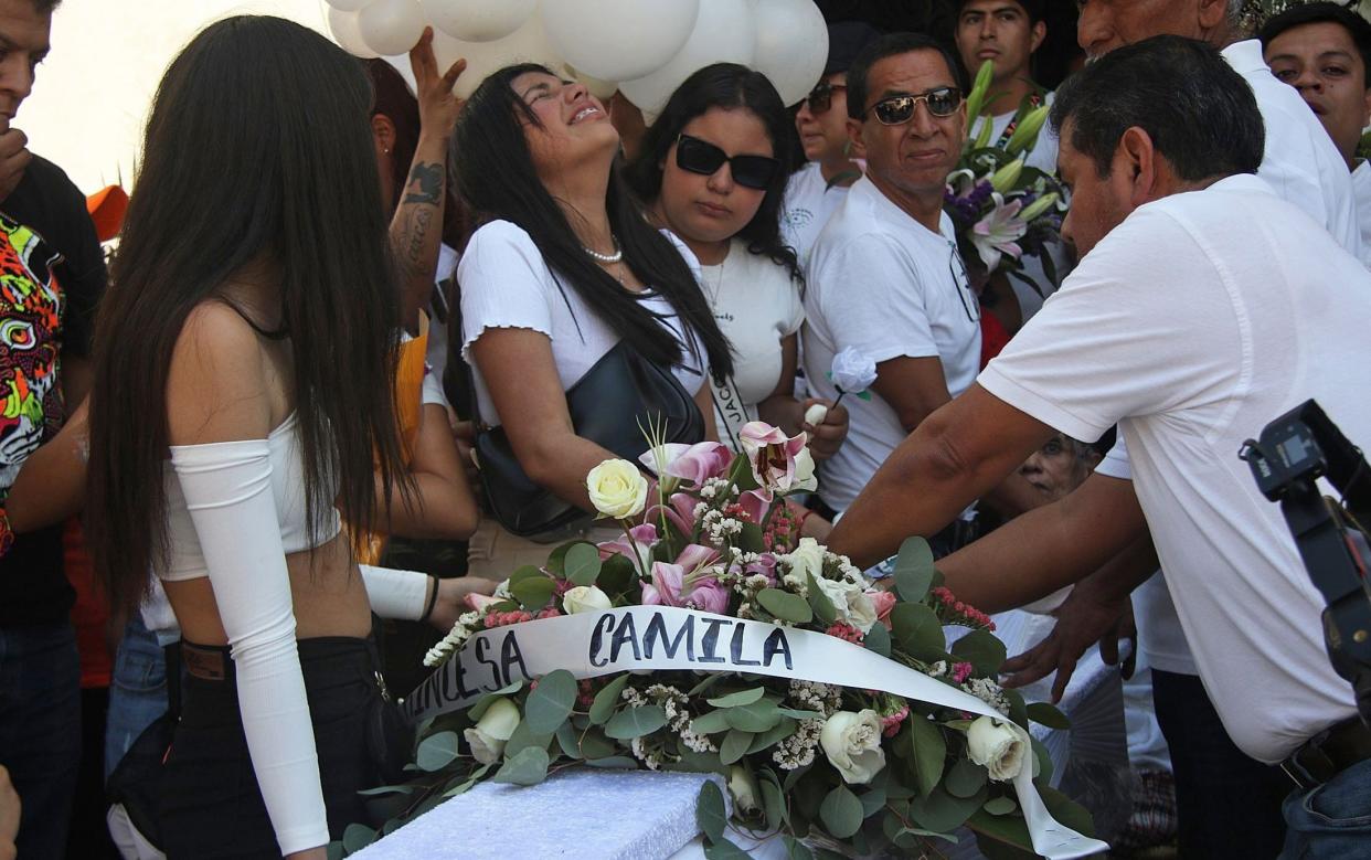 Family and friends attend the funeral of the eight-year-old girl