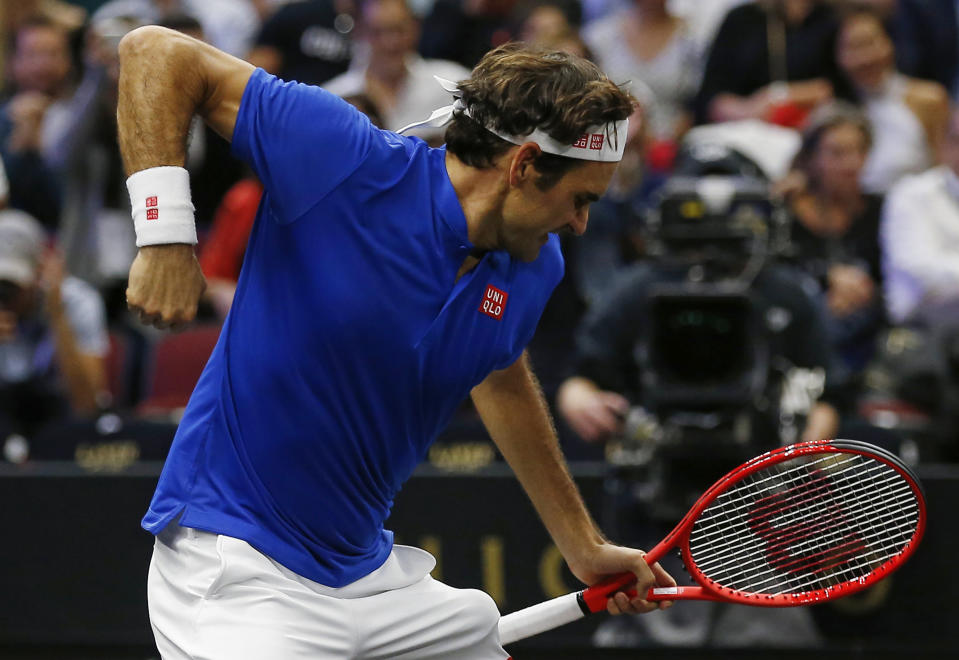 Team Europe's Roger Federer celebrates a point during a men's singles tennis match against Team World's John Isner at the Laver Cup, Sunday, Sept. 23, 2018, in Chicago. (AP Photo/Jim Young)