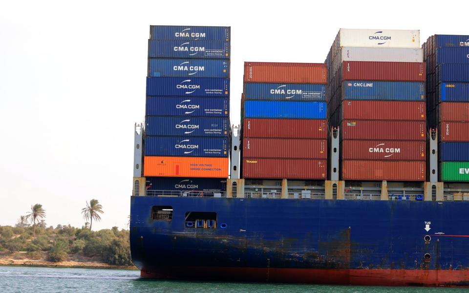 A cargo ship crosses the Suez Canal linking the Red Sea to the Mediterranean