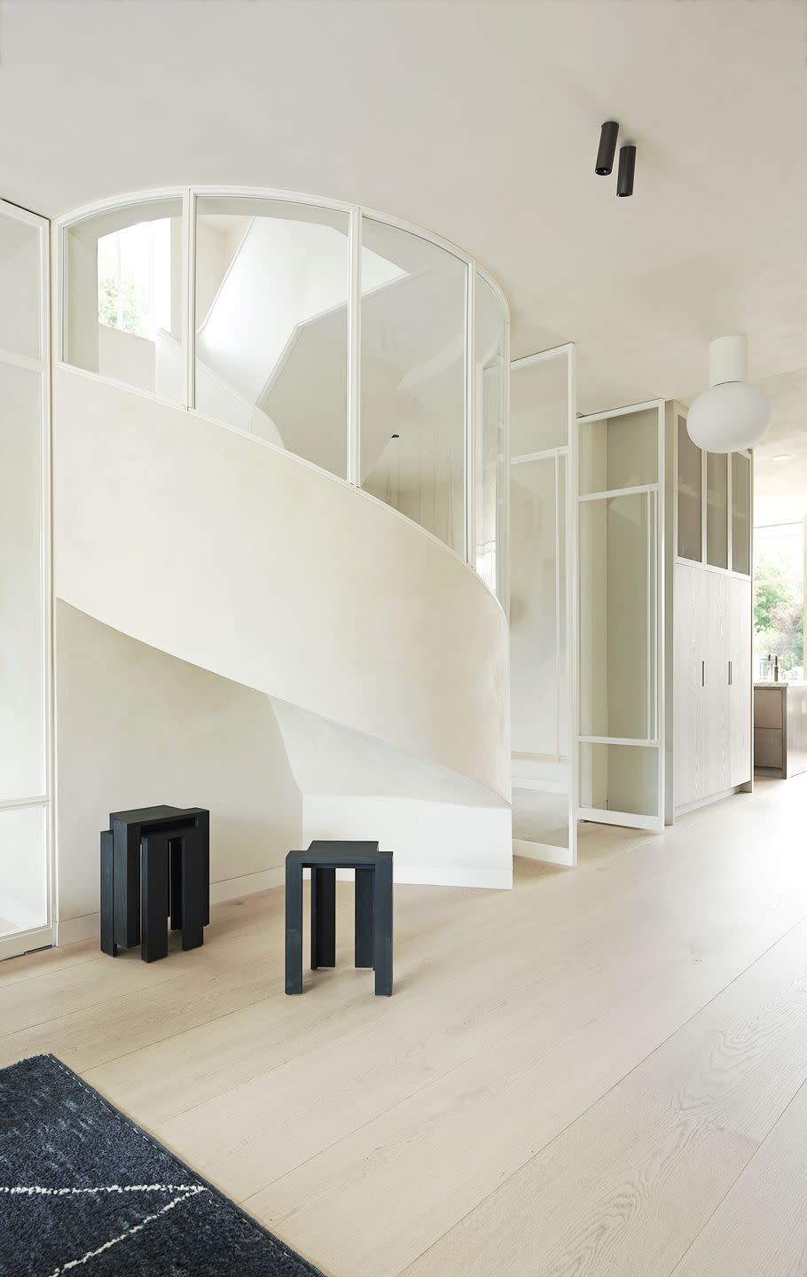 canal house in amsterdam home of interior designer anita fraser ground floor living room staircase