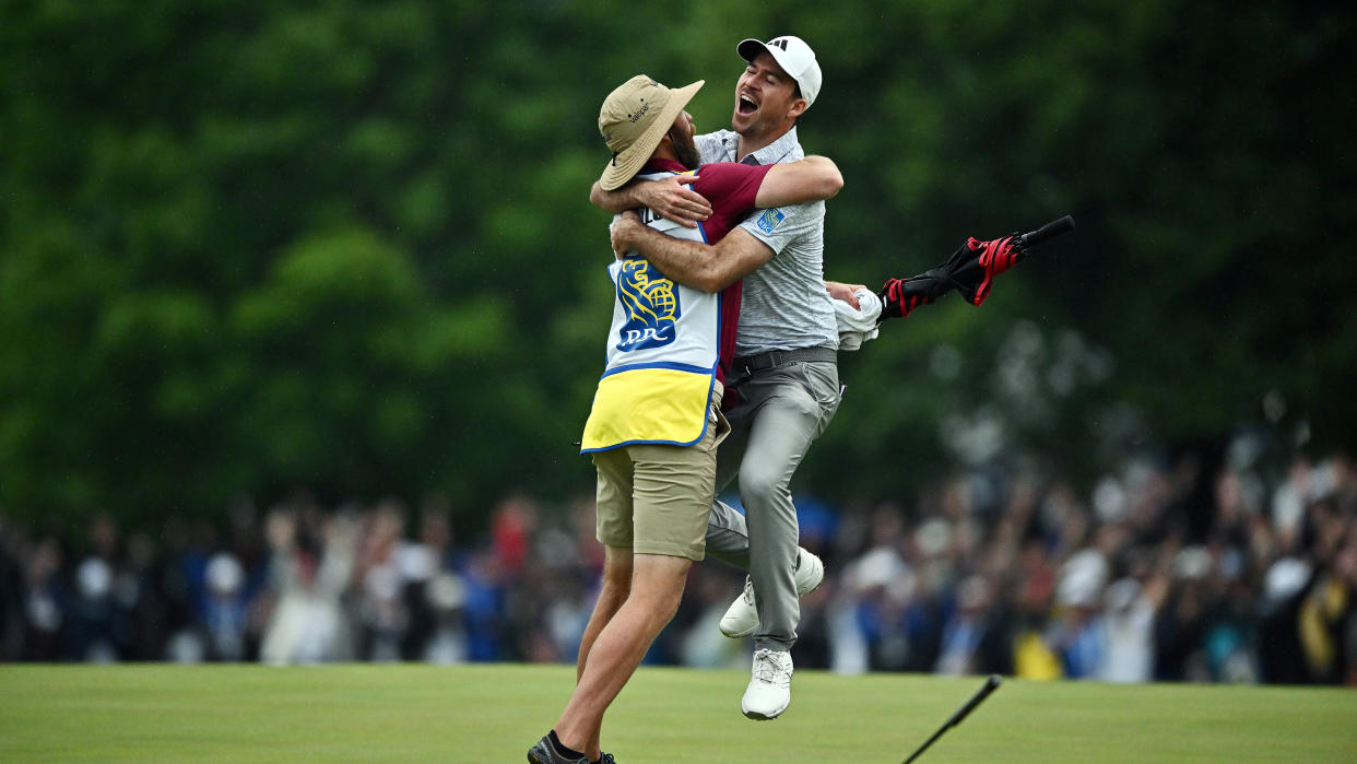  Nick Taylor of Canada celebrates with his caddie after making an eagle putt on the 4th playoff hole to win the RBC Canadian Open 