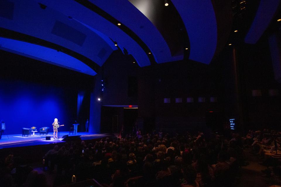 A crowd of guests listen as Dolly Parton sings two songs to conclude her Imagination Library of Kansas celebration Monday in The White Theater in Overland Park.