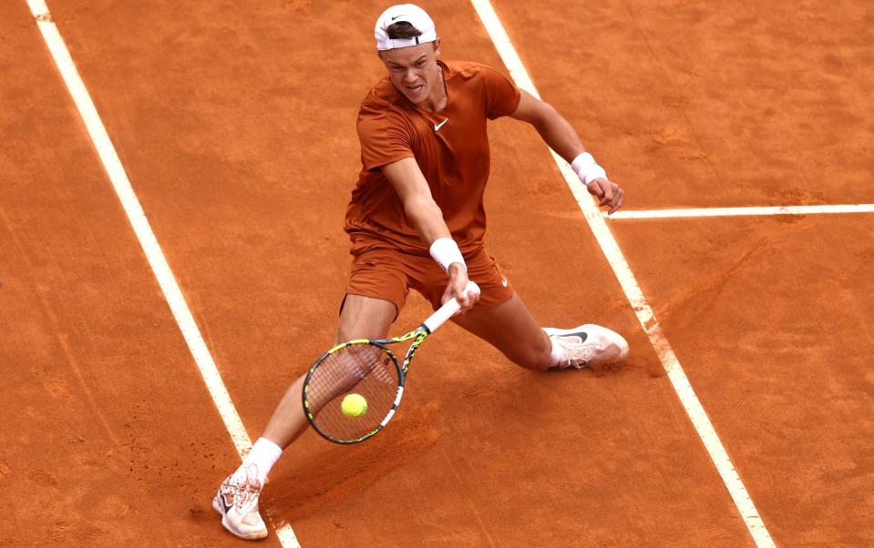 Holger Rune of Denmark plays a forehand against Novak Djokovic of Serbia during their Men&#39;s Singles quarter-final match on day ten of Internazionali BNL D&#39;Italia 2023 at Foro Italico - Getty Images/Alex Pantling