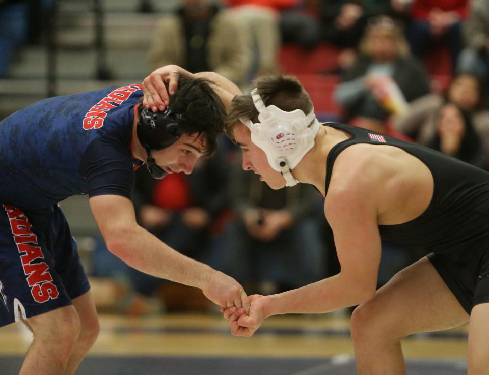 Ketcham's Brendan Carroll versus Arlington's Tim Bova during Wednesday's match on January 8, 2020.  