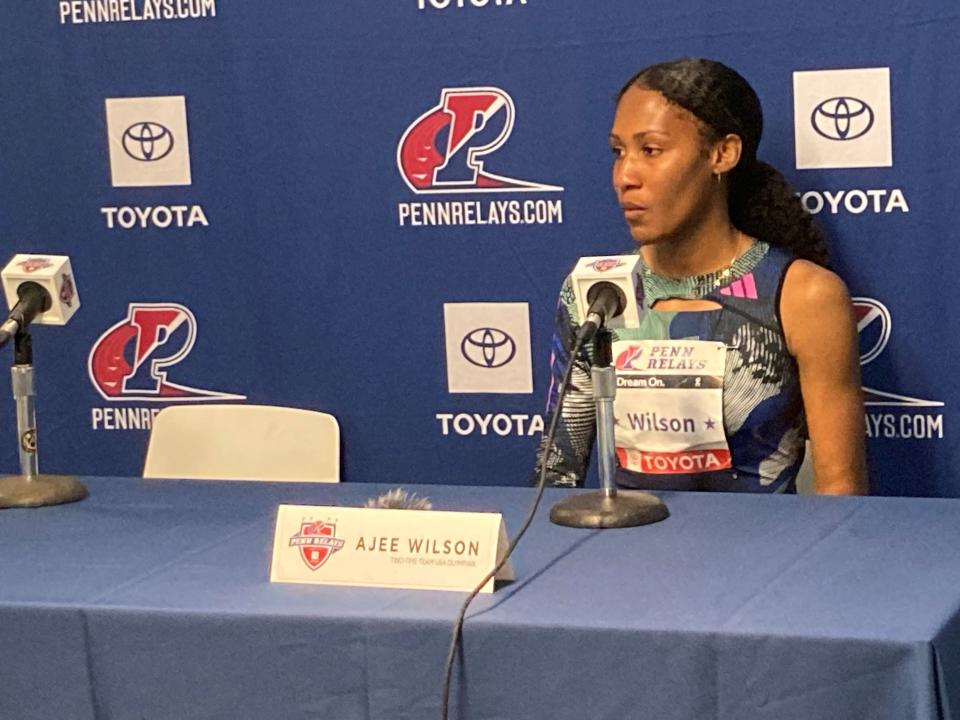 Neptune's Ajee' Wilson speaks with reporters after her victory at the 2023 Penn Relays