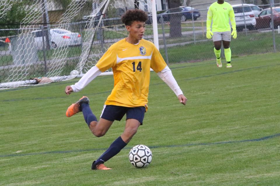 Northeast's Victor Reed (14) kicks the ball toward the midfield during their varsity soccer game against Henry County Thursday, April 7, 2022 at Northeast High School in Clarksville, Tennessee.