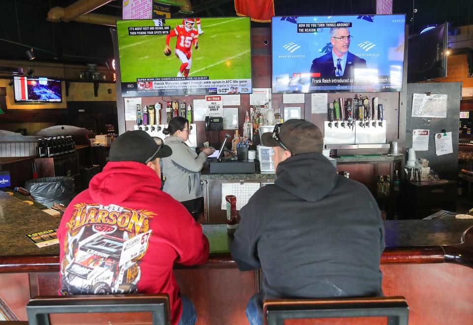 TVs abound at Johnny J's Pub & Grille in Akron to view the Super Bowl.