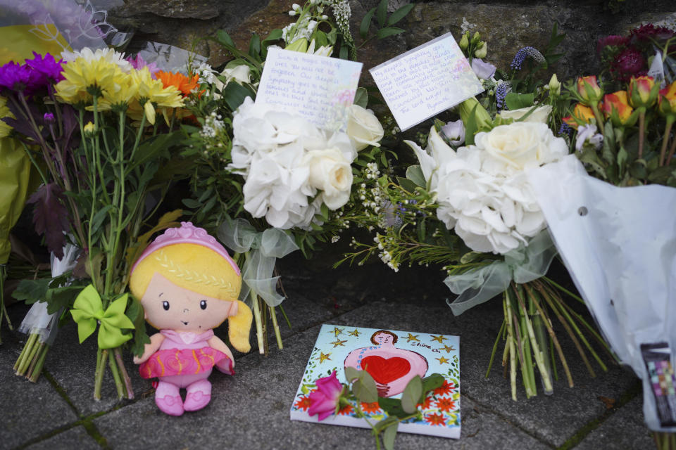 Flowers are left at the scene of a shooting in the Keyham area of Plymouth, England, Saturday, Aug. 14, 2021. Britain’s police watchdog says it has launched an investigation into why a 22-year-old man who fatally shot five people in southwestern England was given back his confiscated gun and gun license. Police have said Jake Davison killed his mother and four other people, including a 3-year-old girl, before taking his own life in Plymouth. (Ben Birchall/PA via AP)