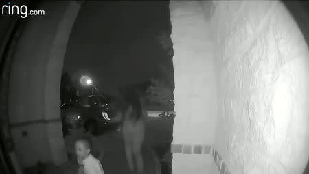 A woman is seen leaving a two-year-old boy at a house of a stranger in a northern Houston suburb, in this still image from video released by the Montgomery County Sheriff’s Office in Texas, U.S., on October 18, 2018. Courtesy Montgomery County Sheriff’s Office/Handout via REUTERS