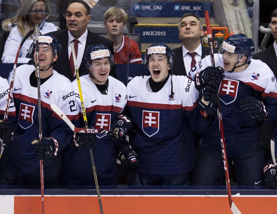 Slovakia players react after defeating Sweden during the third-place game at the hockey World Junior Championship in Toronto on Monday, Jan. 5, 2015. (AP Photo/The Canadian Press, Nathan Denette)