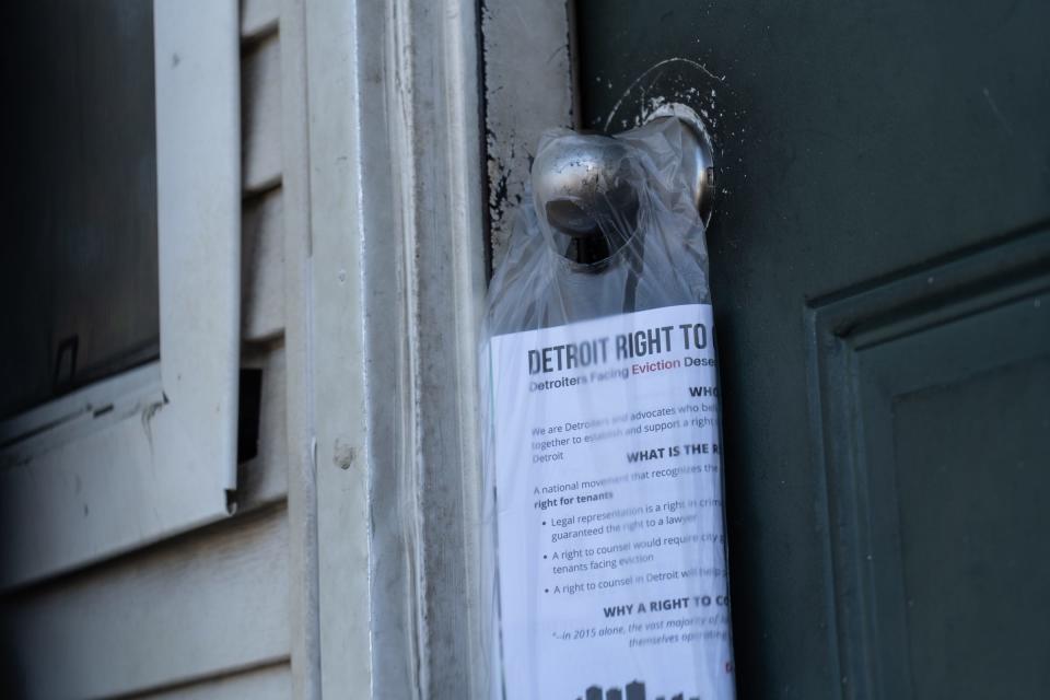 Flyers were left on a door as volunteers hand out literature about federal rent aid at Martin Luther King I & II homes in Detroit on Sept. 24, 2021.