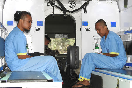 Malaysians are pictured inside a military ambulance after they were rescued by the Filipino soldiers from the Abu Sayyaf rebels, on Jolo island in southern Philippines March 27, 2017. REUTERS/Nickee Butlangan