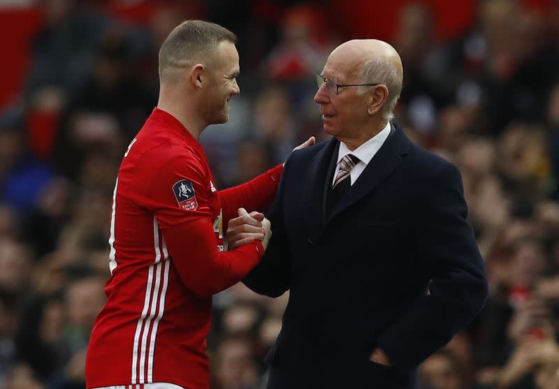 Manchester United's Wayne Rooney with Sir Bobby Charlton before the match