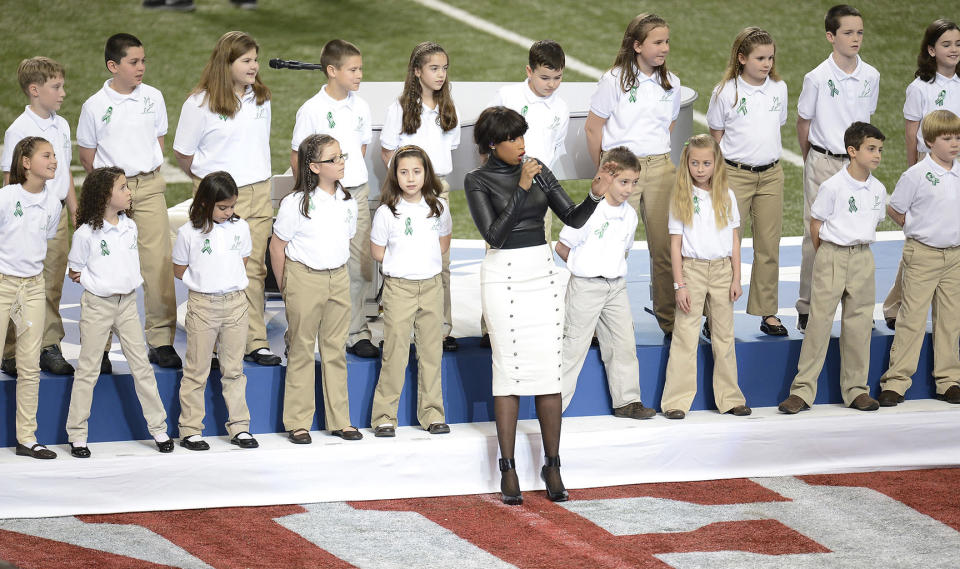 Jennifer Hudson and a choir from Newtown, Connecticut, perform before the start of Super Bowl XLVII at the Mercedes-Benz Superdome in New Orleans, Louisiana, Sunday, February 3, 2013. (Harry E. Walker/MCT)