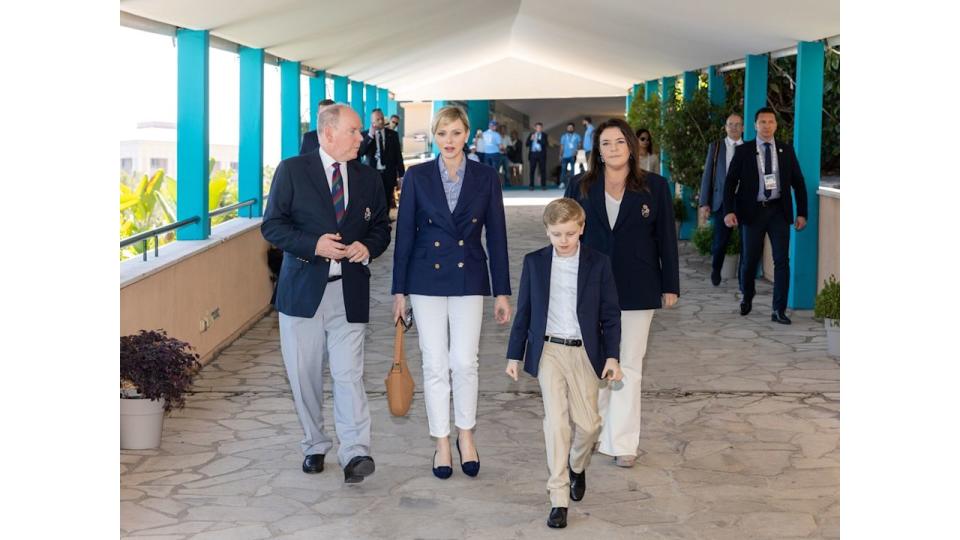 Prince Albert, Princess Charlene and Prince Jacques in pale trousers and dark jackets