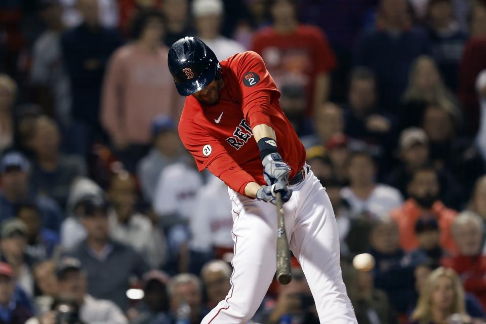 Boston Red Sox's J.D. Martinez hits an RBI single during the eighth inning of the team's baseball game against the Kansas City Royals, Friday, Sept. 16, 2022, in Boston. (AP Photo/Michael Dwyer)