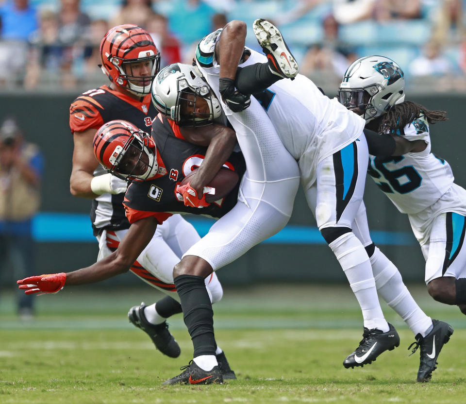 Cincinnati Bengals' A.J. Green, left, is tackled by Carolina Panthers' Shaq Green-Thompson, right, during the second half of an NFL football game in Charlotte, N.C., Sunday, Sept. 23, 2018. (AP Photo/Jason E. Miczek)