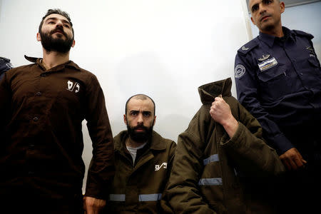 Romain Franck, an employee of the French consulate-general in Jerusalem, appears with co-defendants in the district court in Beersheba, Israel, March 19, 2018. REUTERS/Amir Cohen