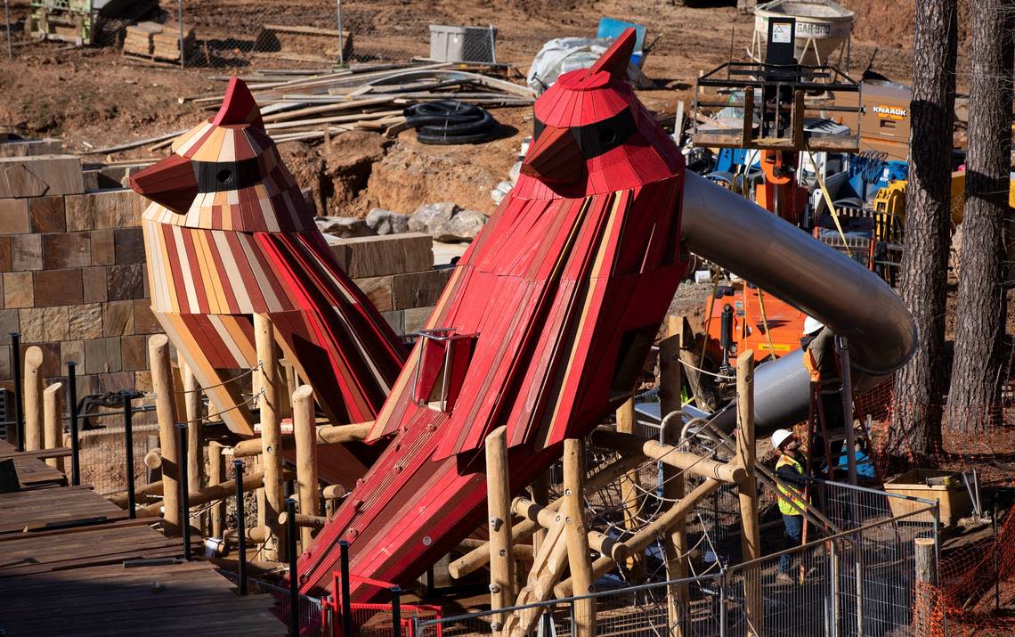Workers continue to assemble the apparatus surrounding two large sculptures of a male and female cardinal at Cary’s Downtown Park. The sculptures are located in a nature-based children’s play area called “The Nest.” Children will be able to climb inside and look out through their eyes, allowing an overview of the park.