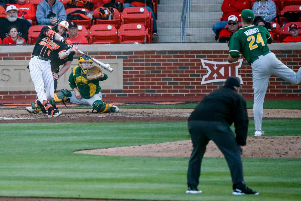 Oklahoma State utility Carson Benge (3) makes contact with a pitch during a college baseball game between the Oklahoma State Cowboys (OSU) and the Baylor Bears at O’Brate Stadium in Stillwater, Okla., on Saturday, March 25, 2023.