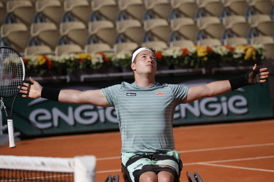 Britain's Alfie Hewett celebrates winning the men's wheelchair final match of the French Open tennis tournament against Belgium's Joachim Gerard at the Roland Garros stadium in Paris, France, Saturday, Oct. 10, 2020. (AP Photo/Christophe Ena)