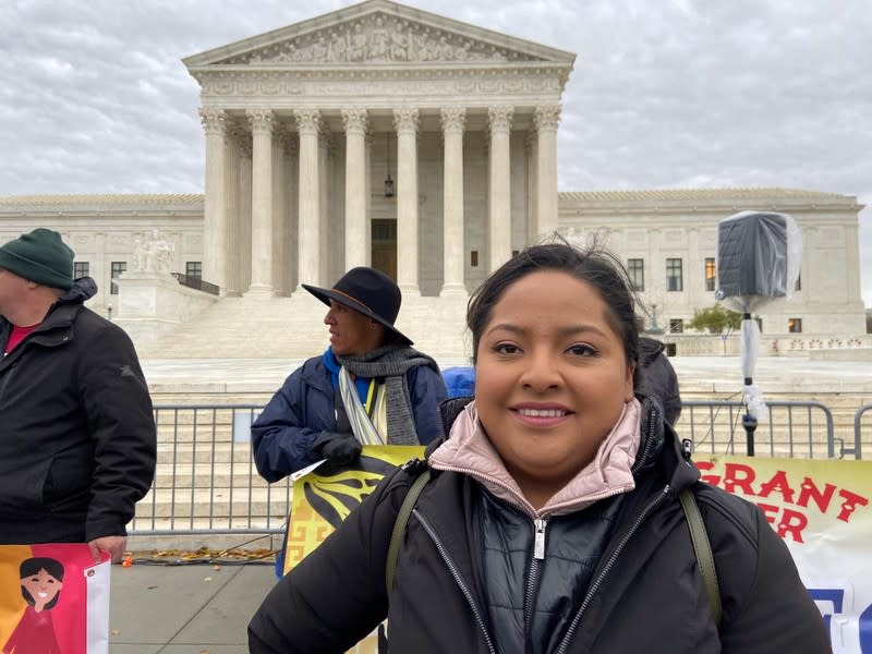 Anel Medina poses outside the U.S. Supreme Court alongside other protesters in Washington