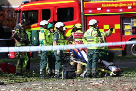 Rescue personnel are seen at the site of an explosion in Linkoping