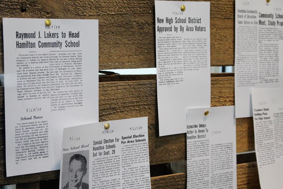 Hamilton Community Schools held its "Hamilton: The Story of Us" event March 11 and 12, showcasing the history of the school and community. Here, newspaper clippings announce the hiring of Ray Lokers as the district's first superintendent.