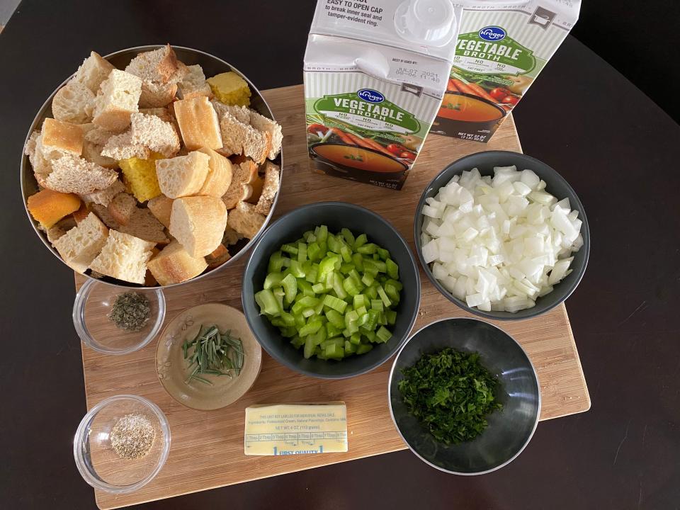 the ingredients for Ree Drummond's stuffing laid out on wooden cutting board
