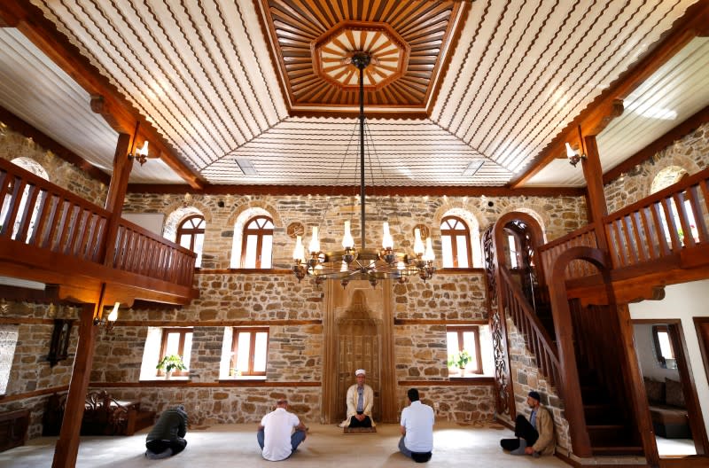 Members of local Islamic council (Dzemat) prepare for praying in an almost empty Sultan Ahmed mosque, as Friday prayers were suspended following the spread of the coronavirus disease (COVID-19), in Zenica