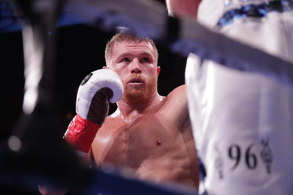 Mexico's Canelo Alvarez, left, fights England's Rocky Fielding during the second round of a WBA super middleweight championship boxing match Saturday, Dec. 15, 2018, in New York. Alvarez stopped Fielding in the third round.(AP Photo/Frank Franklin II)