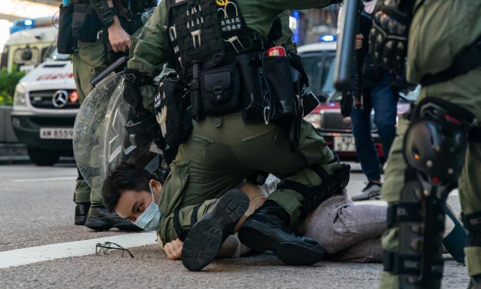 A man is arrested during an anti-government protest in Hong Kong. Freedom swimmer Wong Hung said he could identify with the protesters.