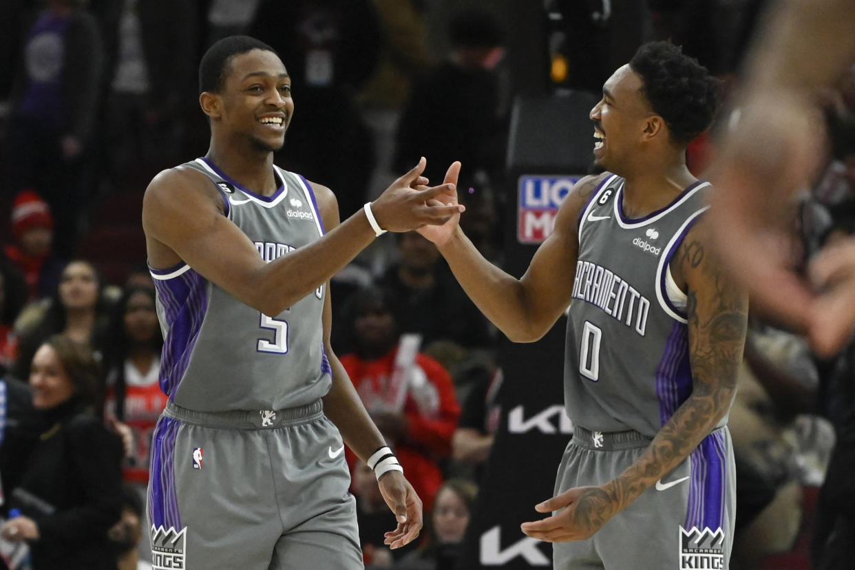 Sacramento Kings guards De'Aaron Fox and Malik Monk celebrate during a game earlier this month. (Matt Marton/USA TODAY Sports)