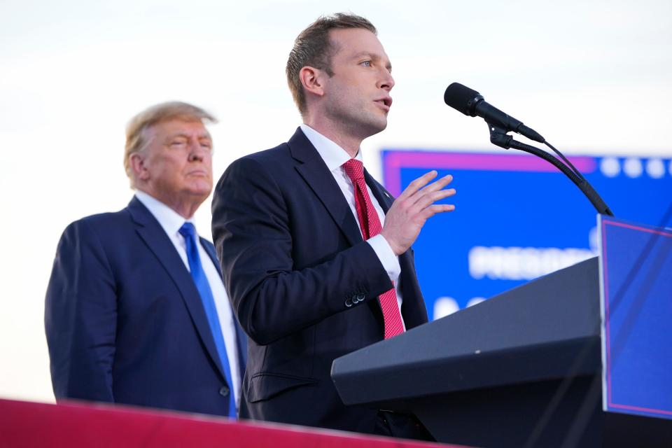 Apr 23, 2022; Delaware, Ohio, USA; Former President Donald Trump listens to Max Miller, a former Trump aide and current republican candidate for Ohio's 7th congressional district, during rally at the Delaware County Fairgrounds. Mandatory Credit: Adam Cairns-The Columbus Dispatch